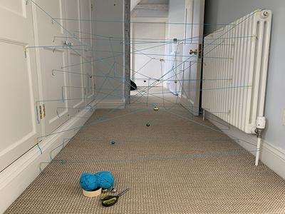 String Laser Maze Game Setup With String And Bells